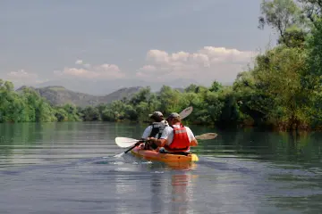 Vranjina island - kayakers on a lake