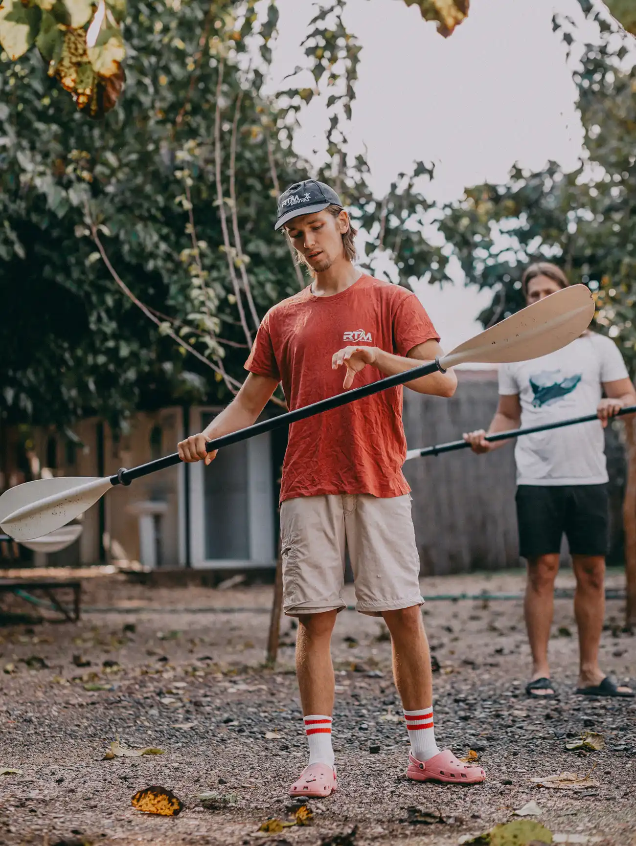 Instructor Rodion Maskalyuk teaching paddle technique on the shoreline