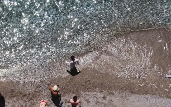 Group of people close to the water