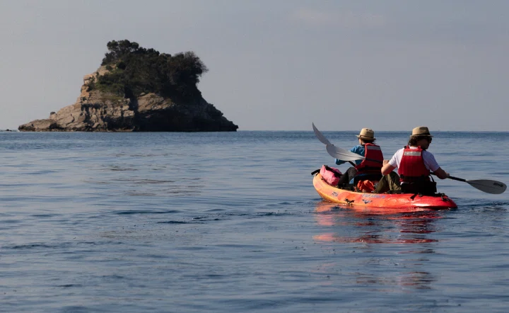 Kayakers paddling toward Sveti Nikola Island off Budva, Montenegro